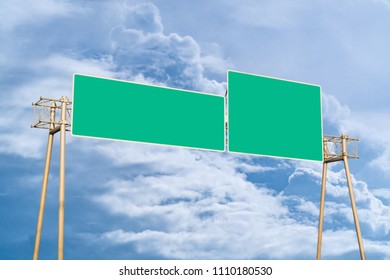 Traffic Sign: A Large Green Road Overhead Marker With Space To Enter Text. Cloudy Sky Background. Copy Space. 