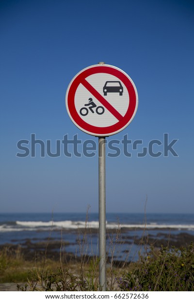 Traffic\
sign, prohibition of cars and bikes together there is beach. North\
of Portugal. Way of Santiago Compostela,\
Spain.