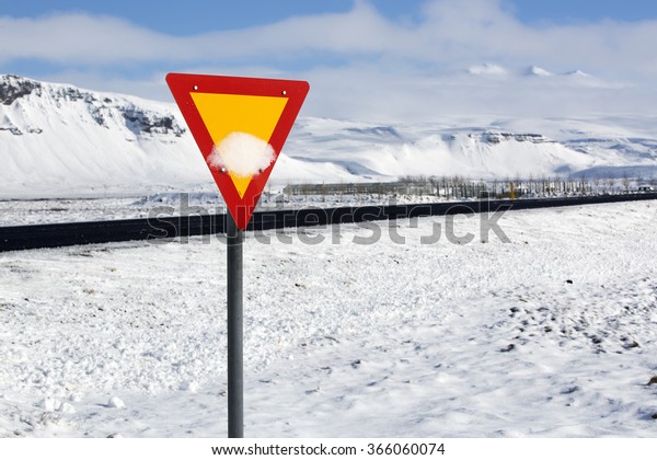 Traffic sign at\
the road in Iceland,\
wintertime
