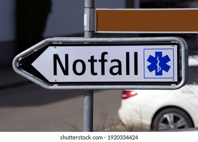 Traffic Sign Showing Direction To Emergency Station Of Hospital At Männedorf, Switzerland. Translation Of Notfall (German) Is Emergency.