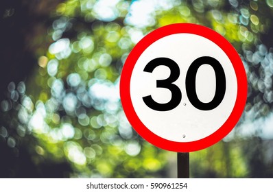 Traffic sign speed limit 30 mph. - Shutterstock ID 590961254