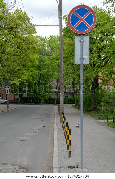 traffic sign stop is prohibited sunny day among\
green leaves