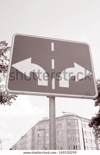 Traffic Sign with Two Arrows Pointing in\
Different Directions