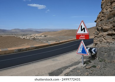 A traffic sign warns of a winding road in the Atlas Mountains - Powered by Shutterstock