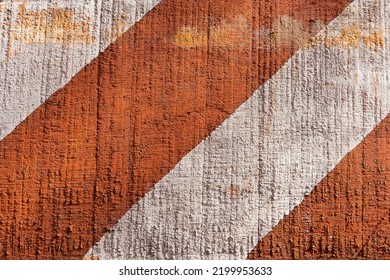 Traffic Signage. Orange And White Slanted Stripes Of Paint On Rustic Wood.