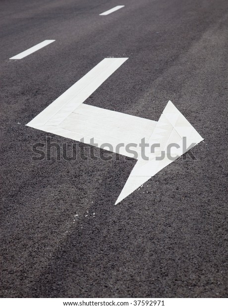 Traffic Signal,turn left signs arrows on\
asphalted surface