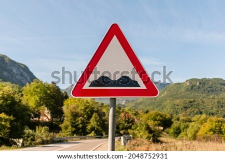 A Traffic signs, bumpy road. Road sign with a warning of a bumpy road. 