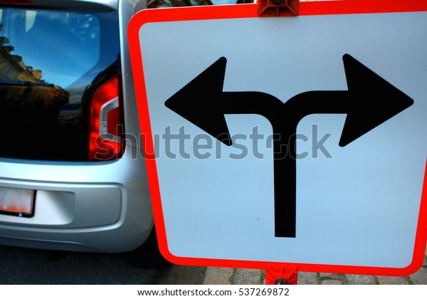 Traffic Signs in front of crossroad, Direction turn\
left or turn right