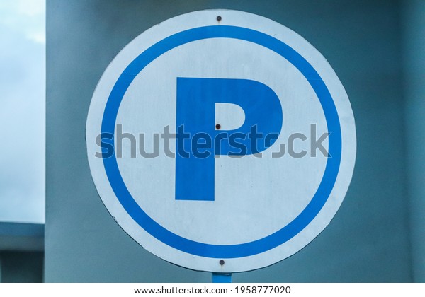 traffic signs with the symbol of the letter P which\
means the parking area. A sign or symbol P is found at a gas\
station so that motorcyclists or car drivers park or stop at a\
designated area or\
place