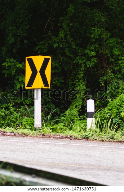 Traffic signs tell the way\
in Thailand