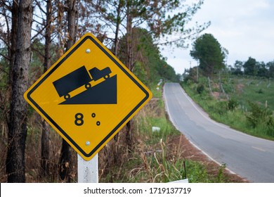 Traffic signs warning up to hill steep road sign to slope a steep climb 8 percent gradient in the road ahead at green grass in the backgroun - Powered by Shutterstock