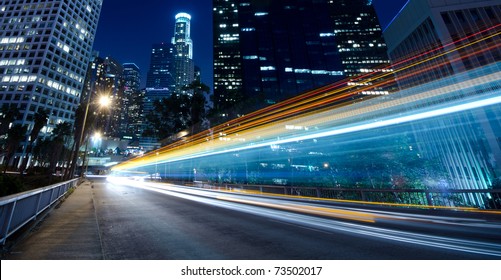 Traffic through the city (traffic seen as trails of light) - Powered by Shutterstock