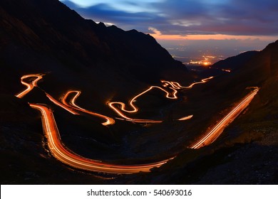 Traffic trails on Transfagarasan pass at night. Crossing Carpathian mountains in Romania, Transfagarasan is one of the most spectacular mountain roads in the world