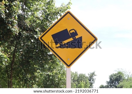 Traffic and travel warning signs located on the side of the road for motorists and road users. The meaning of this sign is Be careful of the path uphill, there is a steep slope.
