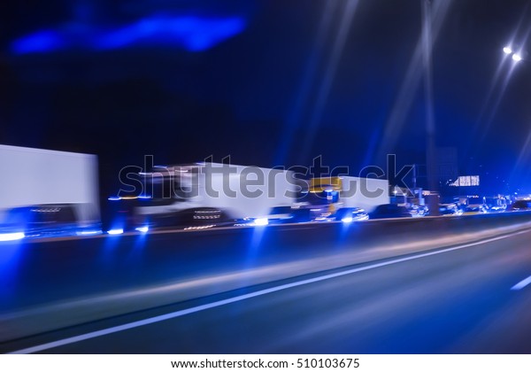 traffic trucks move on\
the night highway
