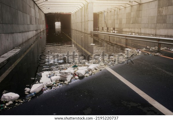Traffic tunnel was so flooded that it\
could not be used with residual waste causing drains to clog Image\
that have been processed and color manipulated\
already