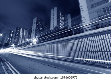 traffic in urban city at night - Shutterstock ID 1896603973