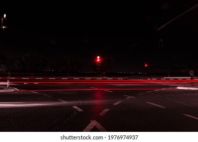 Trafic Light In The Night With Trafic On The Road