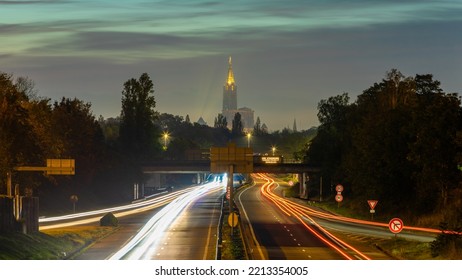 Trafic At Night And The Cathedral Of Strasbourg In Background