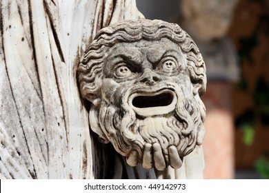 A Tragic Mask In The Hand Of Statue Of Melpomene, The Muse Of Tragedy, On The Balcony Of Achillion Princess Sissy's Palace On Greek Island Corfu In Greece.