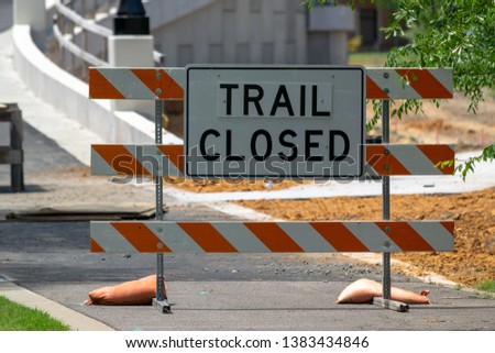 Trail closed sign at the entrance of new construction.