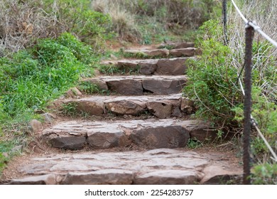 trail made of stone stairs with a railing - Shutterstock ID 2254283757