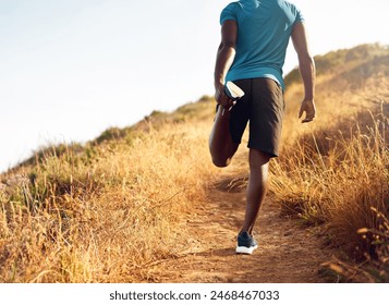 Trail, man or runner stretching legs for fitness training, wellness or exercise outdoors in nature. Path, mountain and healthy male athlete in body warm up to start running or cardio workout on hill - Powered by Shutterstock