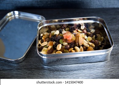 Trail Mix In Stainless Steel Container. Soft Plastic Bag Alternative. New Zealand Supermarkets Are Offering Bring Your Own Container For, Meat, Deli, Bulk Bins. Consumer Change, Sustainability Concept