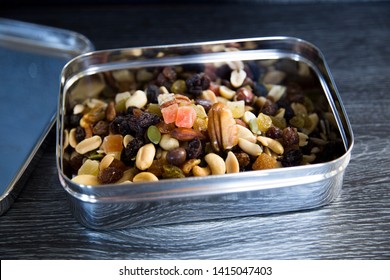 Trail Mix In Stainless Steel Container. Soft Plastic Bag Alternative. New Zealand Supermarkets Are Offering Bring Your Own Container For, Meat, Deli, Bulk Bins. Consumer Change, Sustainability Concept