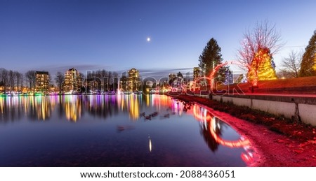 Trail in a park around Lafarge Lake with Christmas Lights. Located in Coquitlam, Greater Vancouver, British Columbia, Canada.
