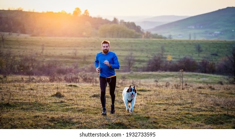 trail runner and his dog running