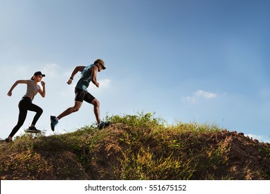 Trail Runner of men and women running on the mountain - Powered by Shutterstock