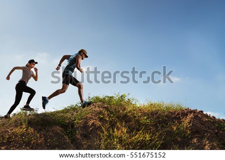 Trail Runner of men and women running on the mountain