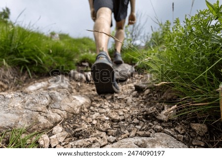 Trail runner running on the mountain trail