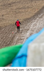 Trail Runner Running Through The Mud To The Finish Line