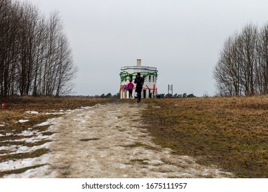 Trail Runner Running Through The Mud And Snow To The Finish Line