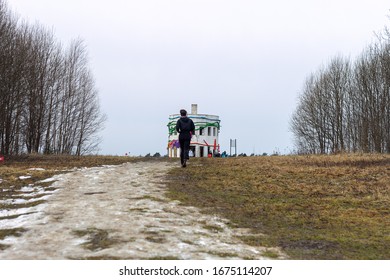 Trail Runner Running Through The Mud And Snow To The Finish Line