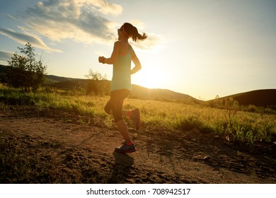 Trail Runner Woman Running On Forest Trail