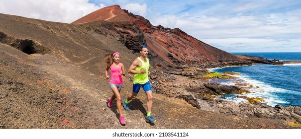 Trail running couple of triathletes runners doing hiit cardio workout outside banner. Two athletes training on coast lansdcape for marathon. Outdoor active people long distance panoramic. - Shutterstock ID 2103541124