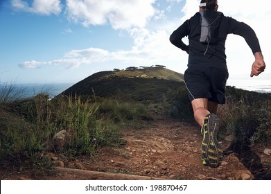 Trail Running Man On Mountain Path Exercising