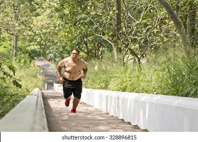 Trail Running. Outdoor Cross-country Running In Sunny Day. Exercising Outdoors For Fitness.Fat Guy Running.