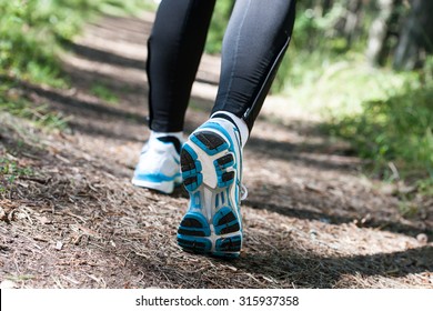 Trail running or trail walking woman