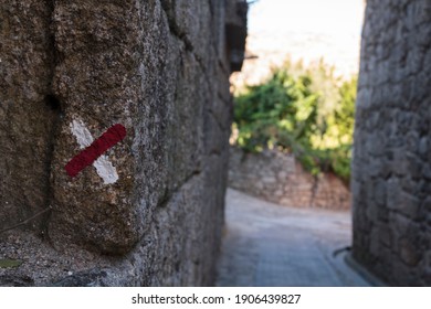 Trail Sign On Wall Marking Wrong Way