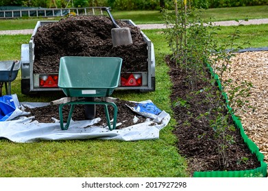 Trailer Full Of Mulch And A Shovel