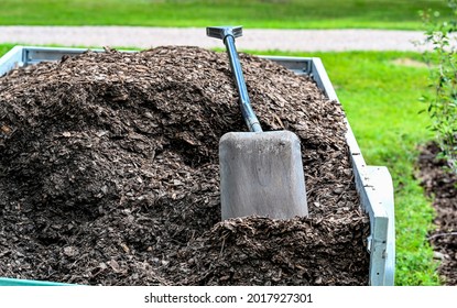 Trailer Full Of Mulch And A Shovel