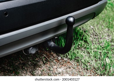 Trailer Hitch Or Towbar On Black Car.