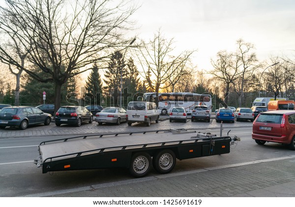 The trailer for transporting cars is\
not loaded. Berlin, Germany. February 19,\
2019.