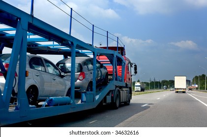 The trailer transports cars on highway