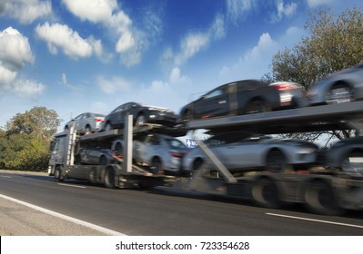 The trailer transports cars highway