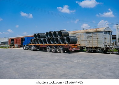 A Trailer Truck Is Loaded With Metal Wire Spool From Train Station 